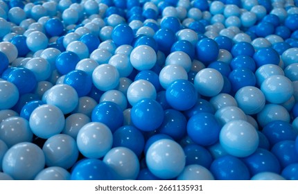 Blue ball pattern. Close up of plastic balls in a kids ball pool. Kids playground. Recreation and entertainment concept. Colorful kid blue ball. Colorful blue ball at the playground