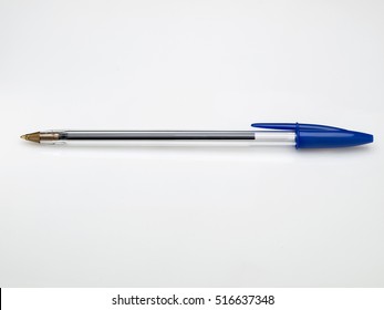 Blue ballpoint pen on white background - Shutterstock ID 516637348