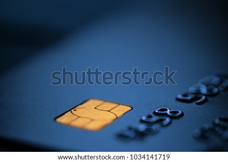 Blue bank credit debit card,blurred copy space,suitable for adding text, macro closeup shot,Coronavirus COVID-19 global pandemic crisis,cryptocurrency alternative EMV method of money transfer concept