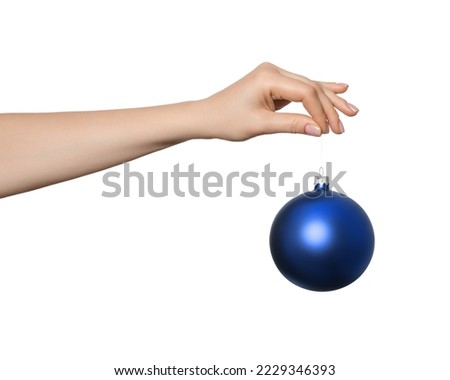 Blue Bauble, christmas ball in a woman's hand