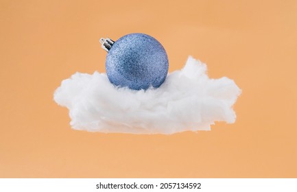 Blue bauble on the cloud. Abstract new year concept.