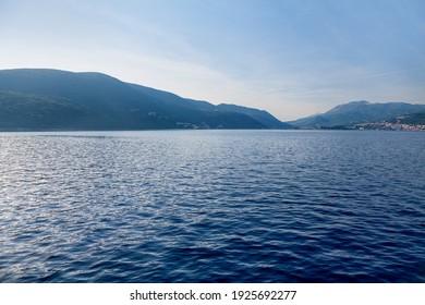 Blue Bay Marine Landscape with Mountains - Powered by Shutterstock