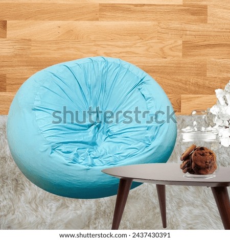 Blue Bean bag sofa. To make it soft and comfortable, the sofa is filled with white foam balls or styrofoam.