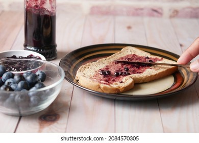 Blue Berry Jam On Bread On Table,