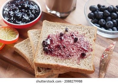 Blue Berry Jam On Bread On Table,