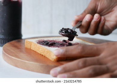 Blue Berry Jam On Bread On Table,