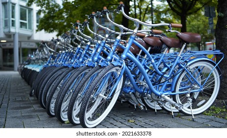 Blue bicycles lined up in rows 