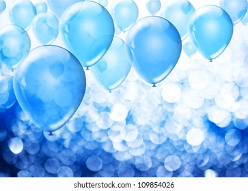 Blue birthday balloons over abstract background with place for text