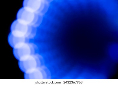 Blue and black abstract dot geometric lightburst pattern