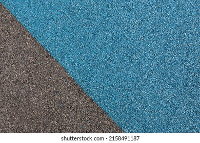 Blue and black rubber coating for playgrounds applied on the surface by a steel trowel. PDM rubber granules. Coating and floor covering for sports. Rubber mulch for safety and injury prevention