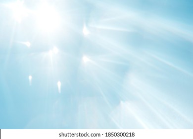 Blue Blurred Background With Sun Rays. Overlay, Copy Space. Clean Sky And Sun Refraction.