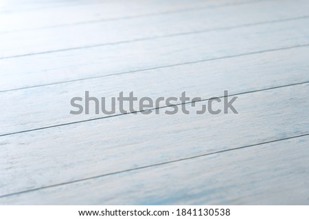 Blue Board aged background in diagonal perspective.