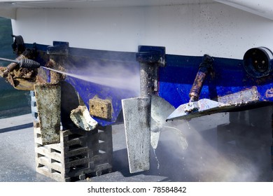 blue boat hull cleaning pressure washer barnacles antifouling and seaweed