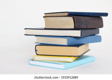 Blue books on white background - Shutterstock ID 1933912889