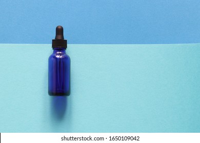 Blue, Bottle, Mint And Blue Colors, Flay Lay. Empty Blue Bottle On A Flat Lay Background. Place For Your Design. Nature And Beauty Concept.