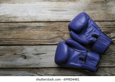 Blue Boxing Gloves On Wood Table  Background. Top View, Close-up