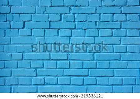 A blue brick wall. The brick wall painted in blue.