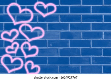 blue brick wall as a template for design. Valentine's day  concept with neon hearts, space for text 
 - Powered by Shutterstock