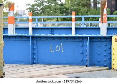 A Blue Bridge Spanning Brooklyn's Gowanus Canal, A 1.8-mile-long Wasteland That's A Designated Superfund Cleanup Site, Bears The Message 