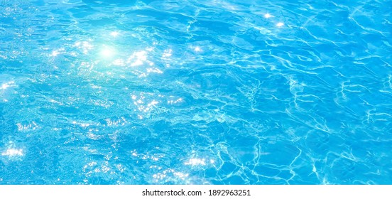 Blue And Bright Pool Water With Solar Reflection, Water Ripple Movement And Gentle Wave In The Pool. Web Panorama Banner With Copy Space.