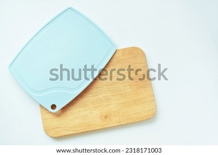 blue and brown wooden cutting board isolated on white background, equipment for cooking in the kitchen