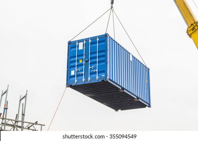 Blue Building Containers, Cargo Containers, Residential Containers At A Loading Crane.