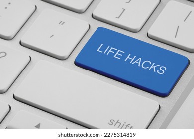Blue button with words Life Hacks on laptop, closeup