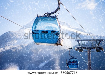 blue cable car lift at ski resort