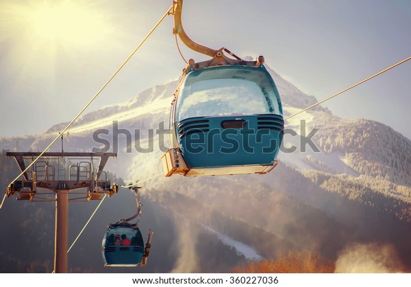 blue\
cable car lift at ski resort. vintage winter\
picture