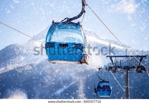 blue cable car lift at ski\
resort