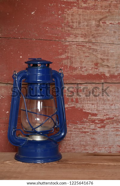 Blue Camping Lantern On Red Barn Stock Photo Edit Now 1225641676