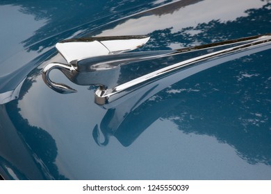 Blue Car With Chrome Hood Ornament