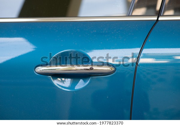 Blue car door handle\
side