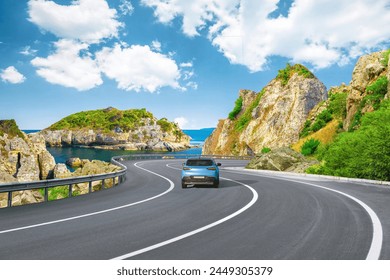 Blue car drive on the road of mediterranean beach. Europe travel trip in sea coast road landscape. holiday journey on nature. driving on coast of France. Highway view on coast on way to summer holiday