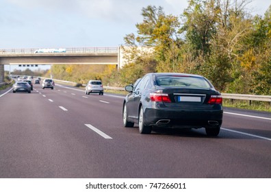 Blue Car Drives On A German Motorway