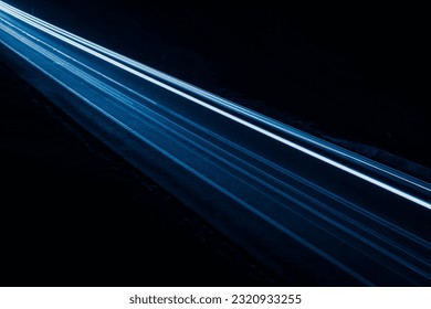 blue car lights at night. long exposure.