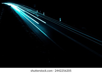 blue car lights at night. long exposure - Powered by Shutterstock