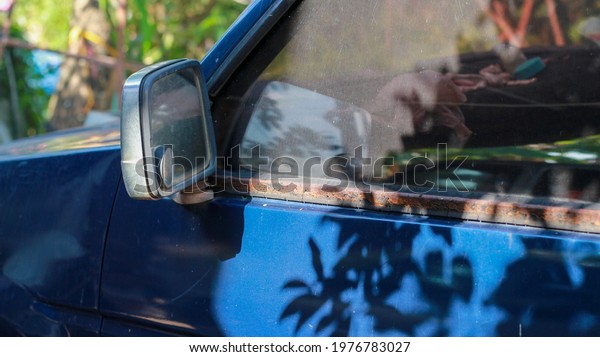 Blue car mirror that reflects on the mirror, car,\
car mirror