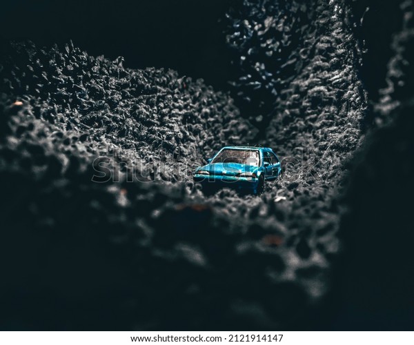 Blue Car photography in a\
mat