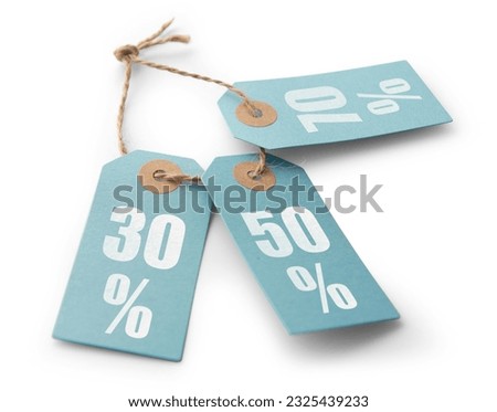 Blue cardboard price tag or label with percent sign isolated. Discount concept. Material for use in creating graphics, advertising