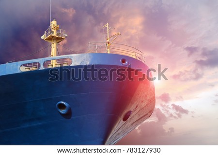blue cargo ship close up forward on blue sky background