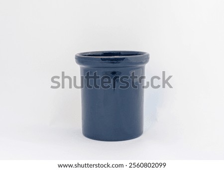 Blue ceramic cache pot on white background with copy space.
