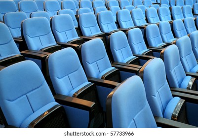 blue chair seats in an empty conference room