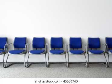 Blue Chairs In Ordinary Empty Waiting Room