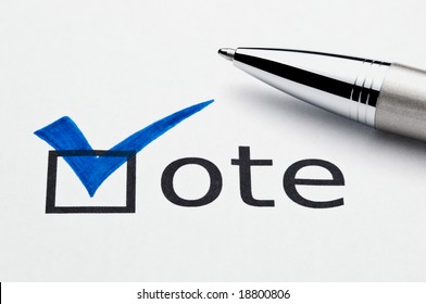 Blue checkmark on vote checkbox, pen lying on ballot paper. Concept for voter registration and participation in elections, or for voting blue/democrat; not an isolation, paper texture is visible