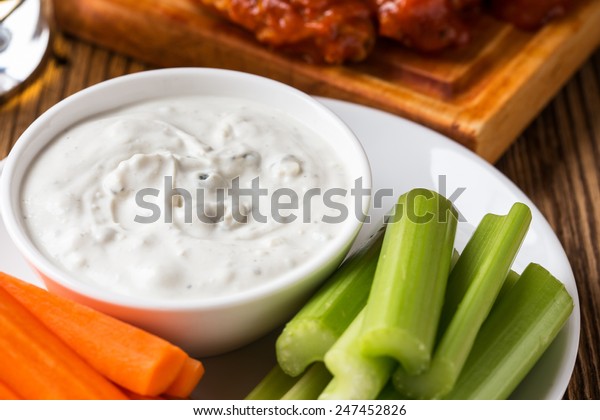 Blue cheese dressing, popular dip with buffalo\
wings and raw vegetables