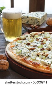 Blue Cheese Pizza With A Glass Of Beer And Some Ingredients