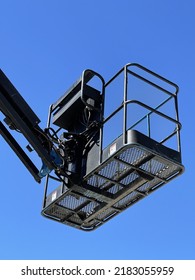 Blue Cherry Picker On Blue Sky Background