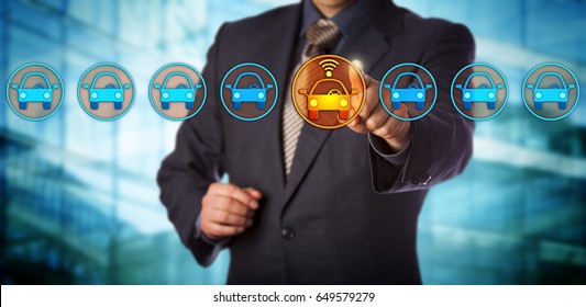 Blue Chip Automobile Designer Selecting A Connected Auto In A Lineup. Concept For Autonomous Or Driverless Car, Vehicle Tracking System, Artificial Intelligence And Vehicular Communication Systems.