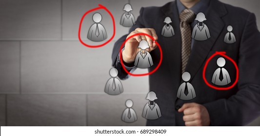 Blue chip marketing manager is circling three candidates in a group of male and female white collar icons. Business concept for target audience, market segmentation, sales prospecting and recruiting.
